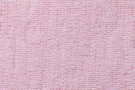 Light pink textile background closeup. Structure of the fabric macro.の写真素材