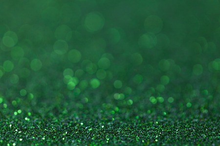 Dark green sparkling background from small sequins, closeup. Brilliant and diamond backdrop.の写真素材
