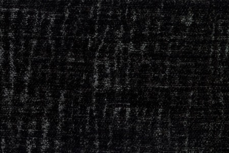 Black background of soft, fleecy cloth. Texture of textile closeup.