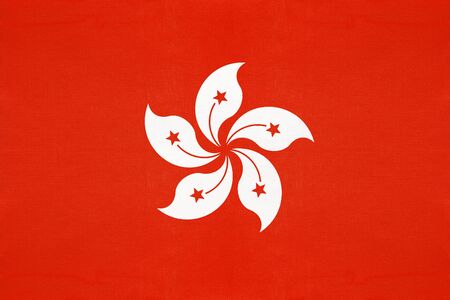 Hong Kong national fabric flag, textile background. Symbol of international asian world country. China state official sign.の写真素材