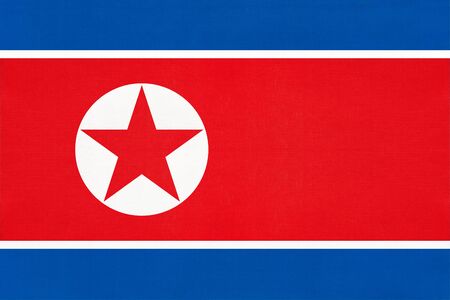 North Korea national fabric flag textile background. Symbol of international world asian country. State official korean sign.の写真素材