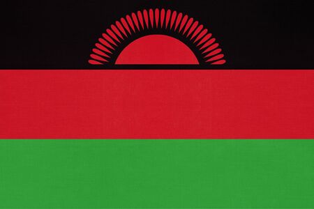 Republic of Malawi national fabric flag, textile background. Symbol of international african world country. State official sign.の写真素材
