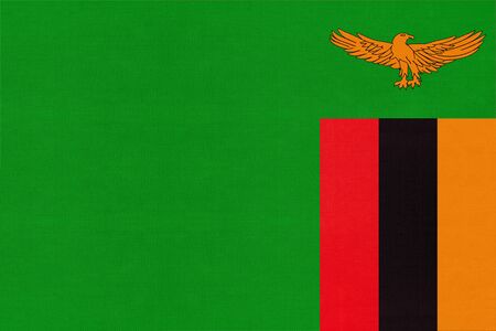 Republic of Zambia national fabric flag, textile background. Symbol of international world African country. State Zambian official sign.の写真素材