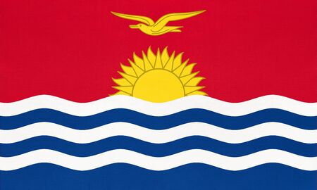 Republic of Kiribati national fabric flag, textile background. Symbol of international world oceania country. State official sign.の写真素材