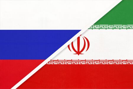 Russia or Russian Federation vs Islamic Republic of Iran national flag from textile. Relationship, partnership and economic between two european and asian countries.の写真素材