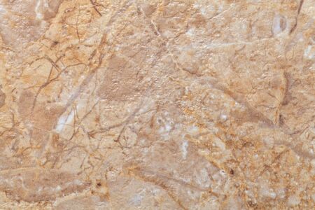 Texture of light brown marble with pattern, macro background. Beige stone backdrop from mineral...