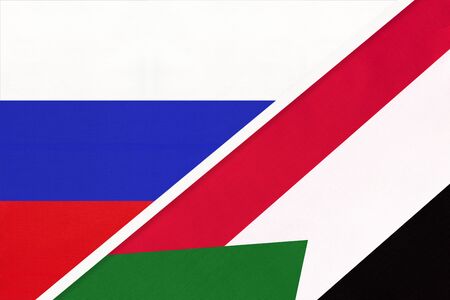 Russia or Russian Federation vs Republic of the Sudan symbol of two national flags from textile. Relationship, partnership and championship between Asian and African countries.の写真素材
