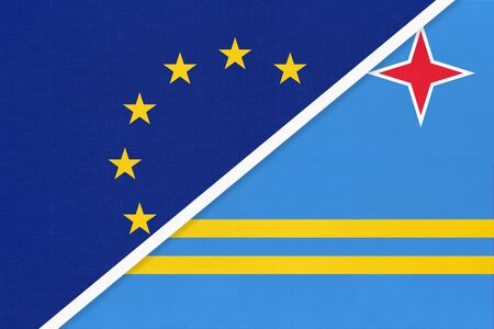 European Union or EU vs Aruba national flag from textile. Symbol of the Council of Europe association opposite American country. Europe championshipの写真素材