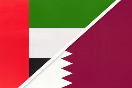 United Arab Emirates or UAE and Qatar, symbol of national flags from textile. Relationship,...