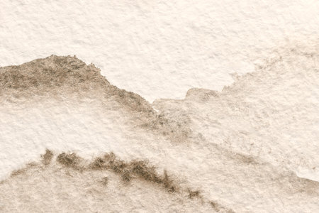 Abstract art background light brown and white colors. Watercolor painting on canvas with soft beige gradient. Fragment of artwork on paper with pattern. Texture backdrop, macro.の写真素材
