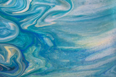 Abstract fluid art background light blue and white colors. Liquid acrylic painting on canvas with...