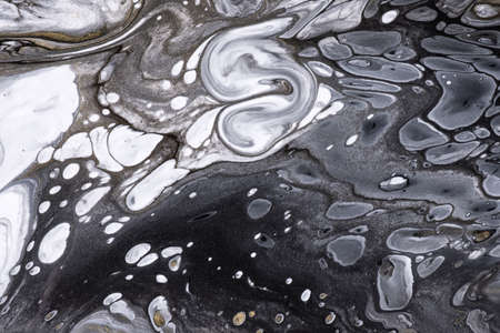 Abstract fluid art background black and white colors. Liquid marble. Acrylic painting on canvas with...