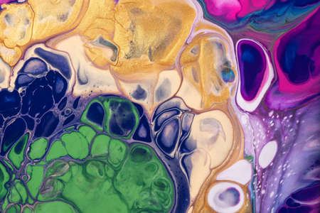 Abstract fluid art background navy blue and golden colors. Liquid acrylic painting on canvas with...