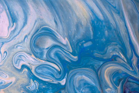 Abstract fluid art background navy blue and white colors. Liquid acrylic painting on canvas with...