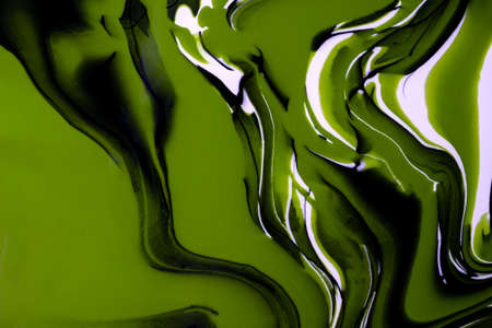 Abstract fluid art background green, white and black colors. Liquid marble. Acrylic painting on canvas with olive gradient and splash. Alcohol ink backdrop with waves pattern.の写真素材
