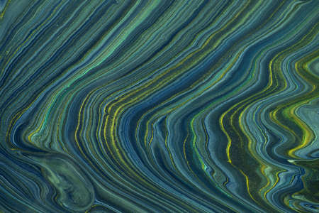 Abstract fluid art background navy blue and green glitter colors. Liquid marble. Acrylic painting on...