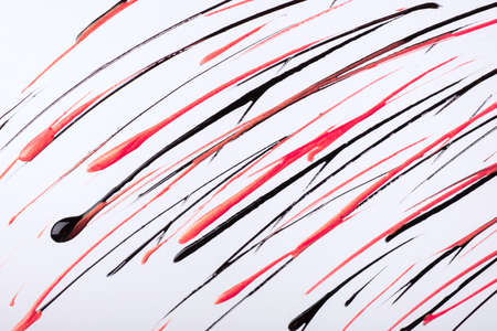 Thin red and black lines and splashes drawn on white background. Abstract art backdrop with rose...