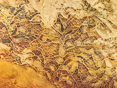 Abstract art background golden color. Watercolor painting on canvas with yellow ornate. Acrylic texture backdrop with brushstroke pattern.の写真素材