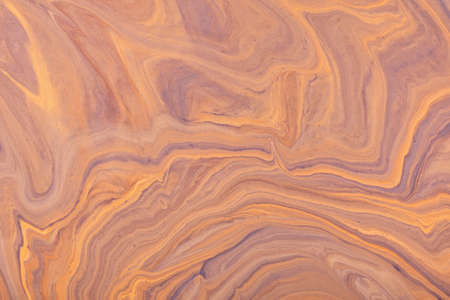 Abstract fluid art background light brown and coral colors. liquid marble. Acrylic painting with beige gradient and splash. Watercolor backdrop with wavy pattern. Stone marble section.の写真素材