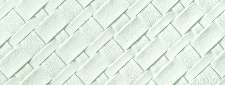 Texture of light green leather background with wicker pattern, macro. Abstract cyan backdrop from...