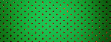 Green background from metal foil paper with pattern of sparkling golden stars with vignette, macro. Texture of metallized wrapping holiday paper surface.の写真素材