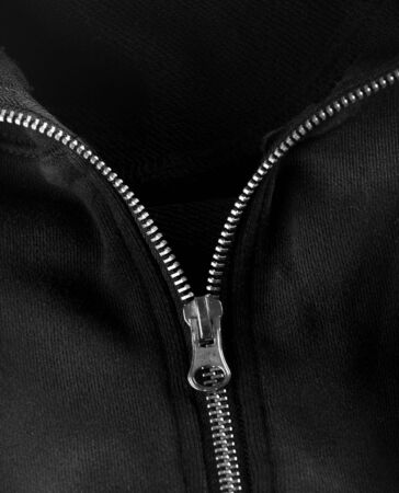 Zipper unzipped on black clothの写真素材