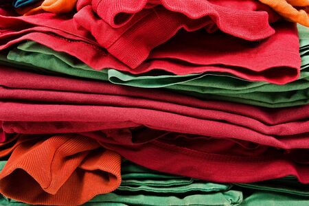 Stack of color clothes stored in rowsの写真素材