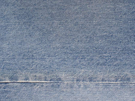 Background a jeans fabric of blue color with a prolineの写真素材