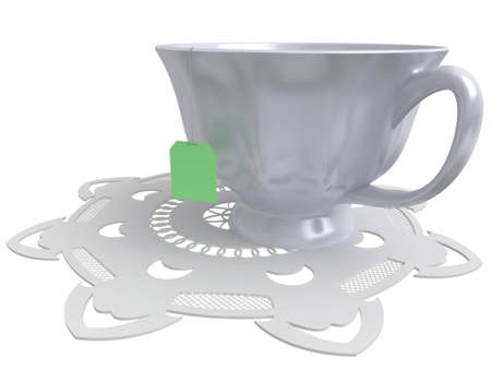 Laying - a cup for tea on a white lacy napkinの写真素材