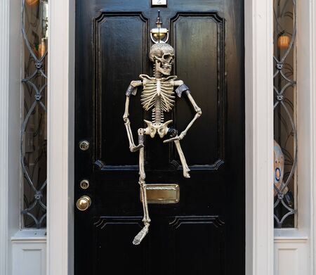 A Hanging Skeleton on a Door on Halloween Day