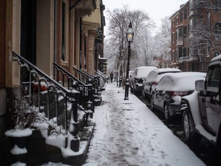 A Man Walks Along the Sidewalk in a Snow Stormのeditorial素材