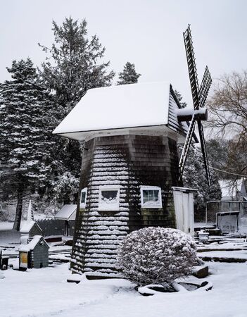 A Miniature Windmill Covered In Snow At A Mini Golf Courseの写真素材