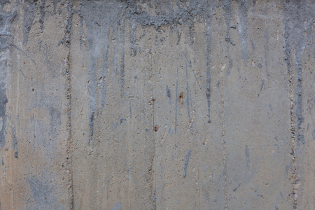 Rough concrete wall texture with rust marksの写真素材