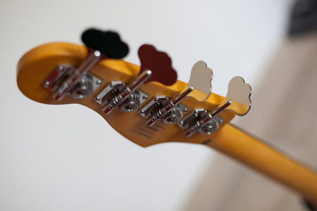 Bass guitar headstock and chrome tuning keysの写真素材