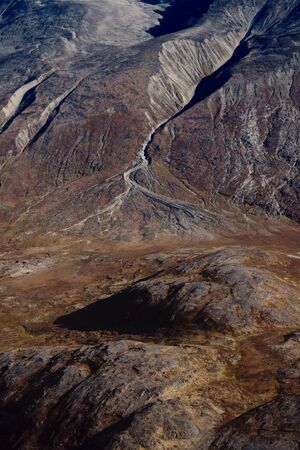 Fall colored raw mountain side in Greenlandの写真素材