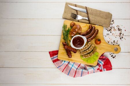 Grilled sausage with garlic and onionsの写真素材