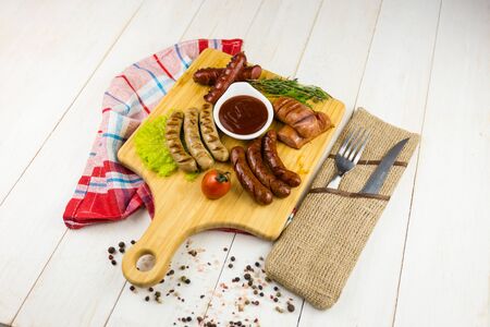 Grilled sausage with garlic and onionsの写真素材