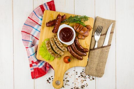 Grilled sausage with garlic and onionsの写真素材