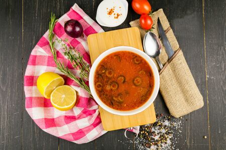 hodgepodge on a wooden background with a linen towelの写真素材