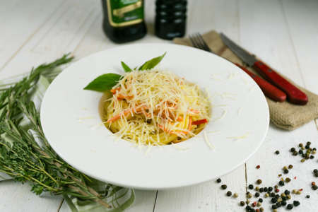 pasta with salmon on a linen towel on a wooden backgroundの写真素材