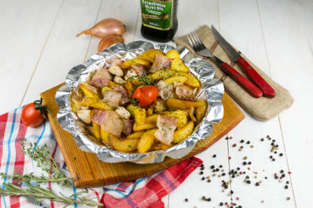 baked potatoes with bacon on a wooden backgroundの写真素材