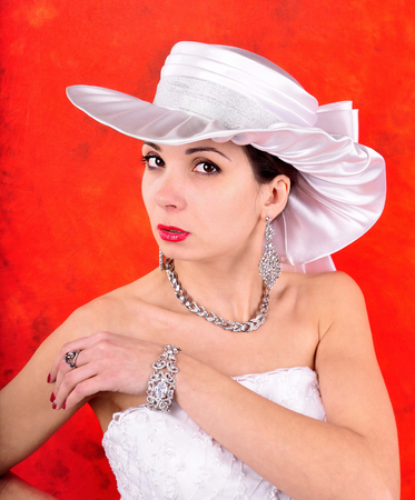young girl in a wedding dress and hatの写真素材