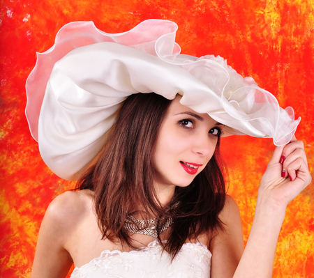 young girl in a wedding dress and hatの写真素材