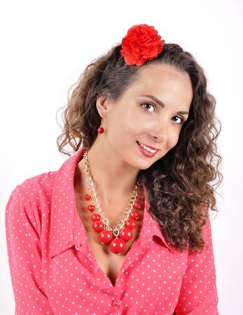 young girl with a red necklace on a white backgrounの写真素材