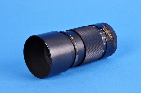 Old manual lens on a blue backgroundの写真素材