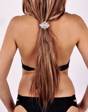 hair gathered by a barrette on the back of a girlの写真素材