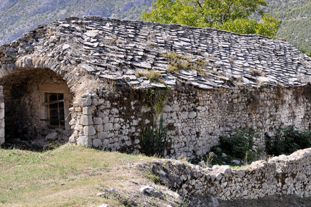 Old medieval stone building with boarded up windowの写真素材