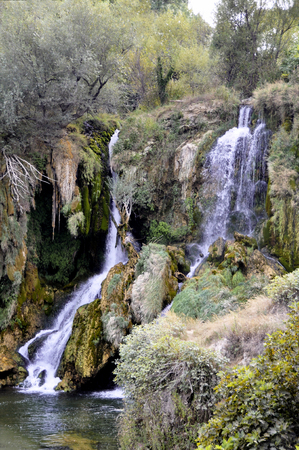 Beautiful Kravica waterfall in Bosnia and Herzegovina - popular swimming and picnic area for tourists.の写真素材