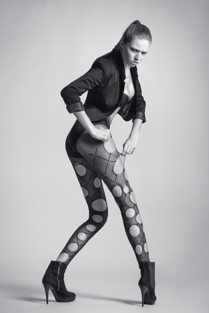 Emotional sexy woman with long legs in stockings. Fashion girl.の写真素材