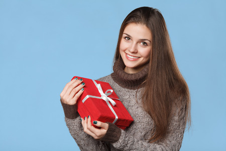 Happy smiling girl in excitement with Christmas box. Christmas Gift